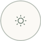 A circular icon with a sun symbol inside, commonly used to represent brightness or screen settings.