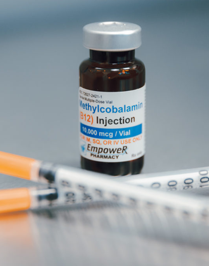 A vial of Methylcobalamin (B12) injection with two syringes.