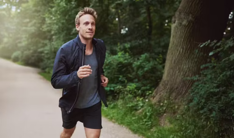 healthy man in jacket jogging at the park 2021 08 26 17 26 21 utc.jpg