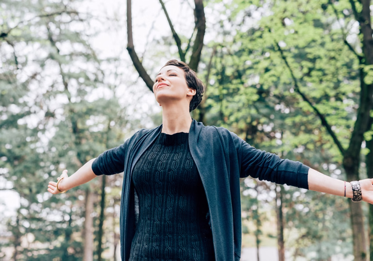 Young woman outdoor feeling free